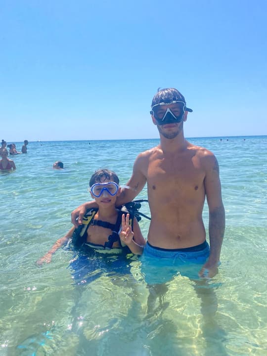 Foto Diving Chia: Primo battesimo, primo sorriso. Il momento esatto in cui un bambino diventa un piccolo sub.